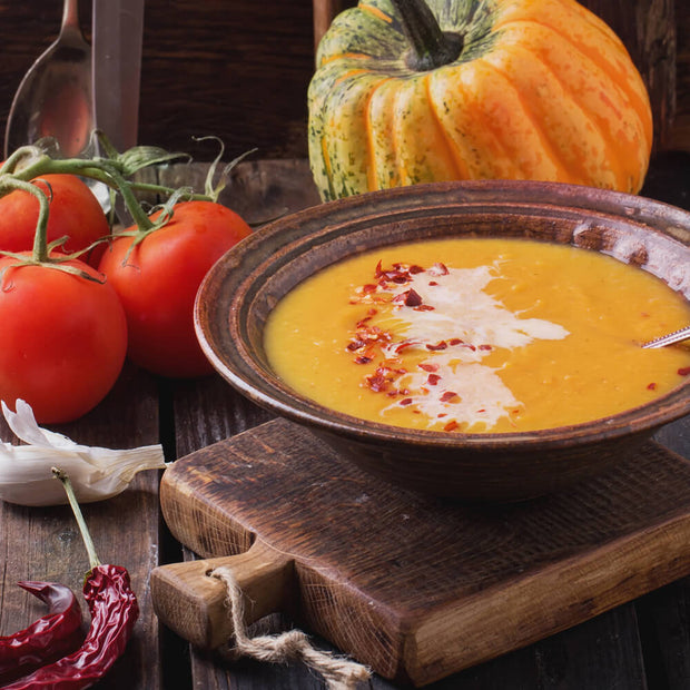 High Quality Organics Express Red Chili Pepper crushed over pumpkin soup 
