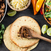 High Quality Organics Express Taco Seasoning on ground beef assembling tacos