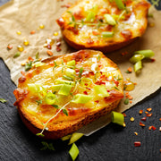 High Quality Organics Express Red Chili Pepper over cheesy toast and green onions